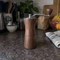 walnut manual coffee grinder, as photographed