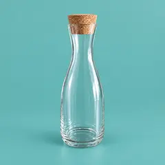 clear narrow-neck glass carafe, as a cover photo