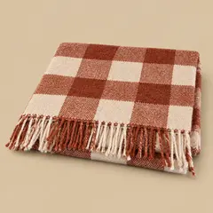 folded rust-and-cream checked woven scarf, as a cover photo