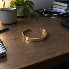 smooth gold open cuff bracelet, as photographed
