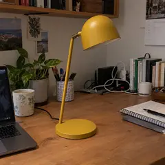mustard-yellow metal desk lamp, as photographed