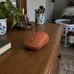 terracotta wireless computer mouse, as photographed
