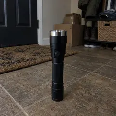 black cylindrical flashlight, as photographed