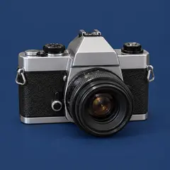 small silver and black vintage-style camera, as a cover photo