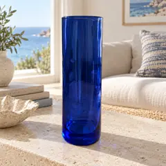 translucent cobalt cylindrical glass vase, moved into a new room