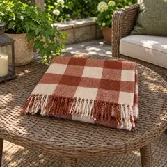 folded rust-and-cream checked woven scarf, moved into a new room