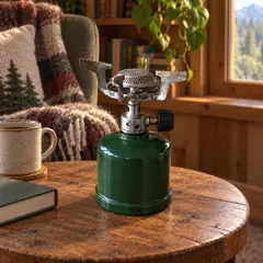 small green single-burner camping stove, moved into a new room