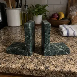 green marble L-shaped bookends, as photographed