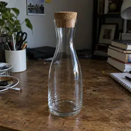 clear narrow-neck glass carafe, as photographed