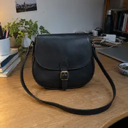 black leather saddle crossbody bag, as photographed