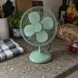 mint small metal desk fan, as photographed