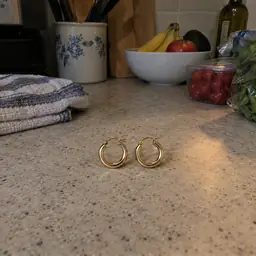 small gold hoop earrings, as photographed