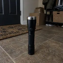 black cylindrical flashlight, as photographed