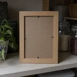 empty pale oak rectangular photo frame, as photographed