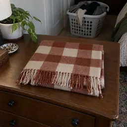 folded rust-and-cream checked woven scarf, as photographed