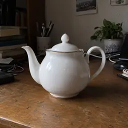 white porcelain teapot, as photographed