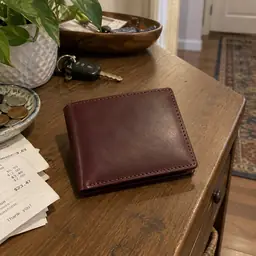 burgundy leather bifold wallet, as photographed