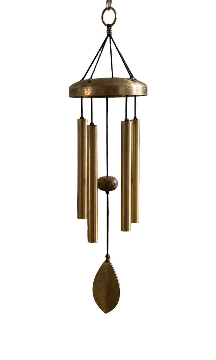 The same wind chime on a white background, cords and all